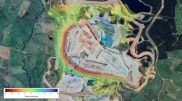 Aerial view of a landscape with a color-coded velocity map overlay.