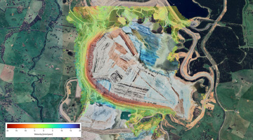 Aerial view of a landscape with a color-coded velocity map overlay.
