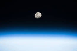 Image of the moon, showing a detailed lunar surface.