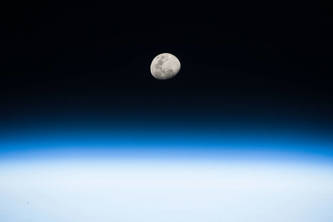 Image of the moon, showing a detailed lunar surface.