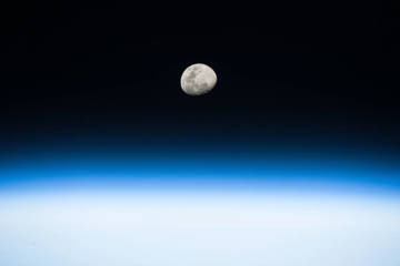 Image of the moon, showing a detailed lunar surface.
