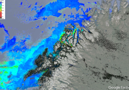 A satellite image from Google Earth showing a mountainous coastal region with varying colors indicating different data points.