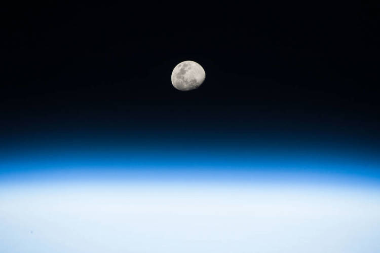 Image of the moon, showing a detailed lunar surface.